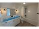 Bathroom featuring a white vanity, dark fixtures, and tub with shower at 1718 26Th Ave. N, North Myrtle Beach, SC 29582