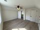 Spacious bedroom with wood-look flooring, ceiling fan, and closet space at 1718 26Th Ave. N, North Myrtle Beach, SC 29582