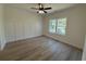 Bedroom featuring hardwood floors, molding, a ceiling fan, and a window with natural light at 1718 26Th Ave. N, North Myrtle Beach, SC 29582