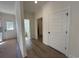 Hallway with hardwood floors and doorways leading to a bathroom and backyard at 1718 26Th Ave. N, North Myrtle Beach, SC 29582
