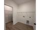 Laundry room with hardwood floors and shelving for storage at 1718 26Th Ave. N, North Myrtle Beach, SC 29582