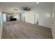 Spacious living room featuring hardwood floors, crown molding, and a ceiling fan at 1718 26Th Ave. N, North Myrtle Beach, SC 29582