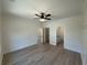 Spacious main bedroom featuring hardwood floors, crown molding, and access to a bathroom and closet at 1718 26Th Ave. N, North Myrtle Beach, SC 29582