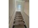 Bright stairway with protective covering on treads leading to upper level at 1718 26Th Ave. N, North Myrtle Beach, SC 29582