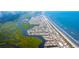 Aerial view of coastal town with houses and waterways at 1837 Seachase Way, North Myrtle Beach, SC 29582