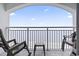 Balcony with rocking chairs and partial ocean view at 2000 N Ocean Blvd. # Ph 3, Myrtle Beach, SC 29577