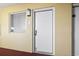 Exterior condo unit entrance with white door and window at 2000 N Ocean Blvd. # Ph 3, Myrtle Beach, SC 29577