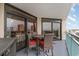 Balcony with table and chairs, offering an ocean view at 205 74Th Ave. N # 709, Myrtle Beach, SC 29572