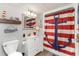 Nautical-themed bathroom with a white vanity, toilet and shower at 205 74Th Ave. N # 709, Myrtle Beach, SC 29572