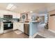 Open kitchen with stainless steel appliances and view to living room at 205 74Th Ave. N # 709, Myrtle Beach, SC 29572