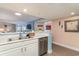Kitchen with white cabinets, stainless steel dishwasher and sink at 205 74Th Ave. N # 709, Myrtle Beach, SC 29572