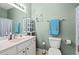 Comfortable bathroom with a single vanity, mirror, and a toilet with a blue towel at 2080 Cross Gate Blvd. # 303, Surfside Beach, SC 29575