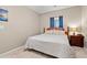 Cozy bedroom featuring a comfortable bed, neutral walls, and a bedside table with a lamp at 2080 Cross Gate Blvd. # 303, Surfside Beach, SC 29575