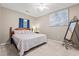 Relaxing bedroom with a queen bed, neutral walls, and a decorative mirror at 2080 Cross Gate Blvd. # 303, Surfside Beach, SC 29575