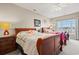 Spacious bedroom with two beds, carpeted floors, a ceiling fan, and natural light from the windows at 2080 Cross Gate Blvd. # 303, Surfside Beach, SC 29575