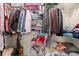 Well-organized closet with shelving and hanging rods filled with clothes and accessories at 2080 Cross Gate Blvd. # 303, Surfside Beach, SC 29575