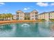 Beautiful condo community featuring manicured landscaping and a tranquil pond with a fountain at 2080 Cross Gate Blvd. # 303, Surfside Beach, SC 29575