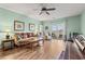 Inviting living room features hardwood floors, cozy seating, and natural light from a sliding glass door at 2080 Cross Gate Blvd. # 303, Surfside Beach, SC 29575