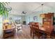 Cozy living and dining area featuring hardwood floors and stylish furnishings with a ceiling fan at 2080 Cross Gate Blvd. # 303, Surfside Beach, SC 29575