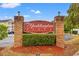 Elegant community entrance sign with brick pillars and lush landscaping at 2080 Cross Gate Blvd. # 303, Surfside Beach, SC 29575