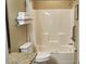A clean bathroom with a shower-tub combo, a toilet, and a towel rack at 241 Presidential Dr., Surfside Beach, SC 29575