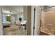 Spacious bedroom with tv, small kitchen and connected bathroom area at 241 Presidential Dr., Surfside Beach, SC 29575