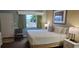 Inviting bedroom offers a queen bed and view of the landscape at 241 Presidential Dr., Surfside Beach, SC 29575
