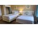 Bright bedroom features two twin beds, closet, and beach-themed decor at 241 Presidential Dr., Surfside Beach, SC 29575