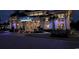 Grand Palms Resort welcomes with illuminated facade, offering check-in and front desk services at 241 Presidential Dr., Surfside Beach, SC 29575