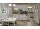 Bright kitchen with white cabinets, granite countertops, and a dining area; perfect for entertaining guests at 241 Presidential Dr., Surfside Beach, SC 29575