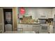 A modern kitchen with white cabinets, a stone countertop, and stainless steel appliances at 241 Presidential Dr., Surfside Beach, SC 29575