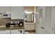 Granite countertops with modern appliances and sink overlooking bathroom area at 241 Presidential Dr., Surfside Beach, SC 29575