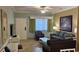 A cozy living room with comfortable furniture, a flat-screen TV, and a decorative mirror and art at 241 Presidential Dr., Surfside Beach, SC 29575