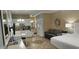 Open concept living space with kitchen, seating area, and queen bed at 241 Presidential Dr., Surfside Beach, SC 29575