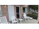 Small patio with white chairs and table at 241 Presidential Dr., Surfside Beach, SC 29575