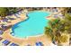 Outdoor community pool with palm trees and lounging areas at 241 Presidential Dr., Surfside Beach, SC 29575