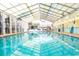 Indoor community pool with overhead roofing and windows to the outside at 241 Presidential Dr., Surfside Beach, SC 29575
