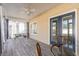 Relaxing screened porch with outdoor seating and ceiling fan at 242 Sienna Dr., Little River, SC 29566