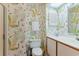 Bathroom with seahorse wallpaper and double vanity at 25 Frigate Ct., Pawleys Island, SC 29585