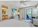 Spacious bedroom with a queen bed, private balcony, and en-suite bathroom at 25 Frigate Ct., Pawleys Island, SC 29585