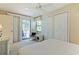 Bedroom with a queen bed, private balcony access, and ceiling fan at 25 Frigate Ct., Pawleys Island, SC 29585