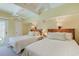 Bedroom with two twin beds, ceiling fan and access to private deck at 25 Frigate Ct., Pawleys Island, SC 29585