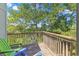 Wooden deck with wooden railings and chairs overlooking the water at 25 Frigate Ct., Pawleys Island, SC 29585