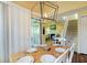 Dining area with a table for four and access to deck at 25 Frigate Ct., Pawleys Island, SC 29585