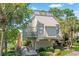 Elevated home with spacious deck, water views, and stairs leading to the entrance at 25 Frigate Ct., Pawleys Island, SC 29585