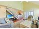 Living room with vaulted ceilings, fireplace and view into kitchen at 25 Frigate Ct., Pawleys Island, SC 29585