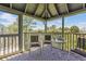 Spacious screened porch with seating area and water views at 25 Frigate Ct., Pawleys Island, SC 29585