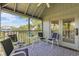 Relaxing screened porch with seating area and water views at 25 Frigate Ct., Pawleys Island, SC 29585
