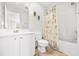 Bathroom with shower/tub combo, white vanity, and beachy decor at 257 Connemara Dr. # E, Myrtle Beach, SC 29579