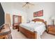 Main bedroom with king-size bed and access to stairs at 257 Connemara Dr. # E, Myrtle Beach, SC 29579